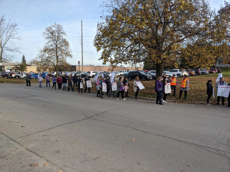 (UPDATED) “My second job paid for this sign:” protestors take to the streets in support of CUPE